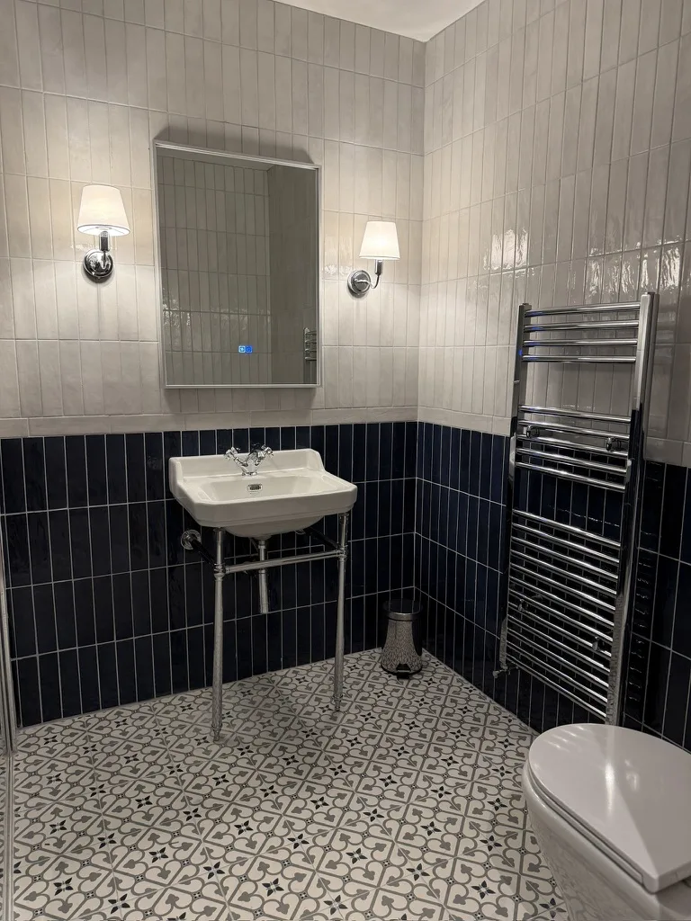 Renovated blue ensuite bathroom at Donegal Manor