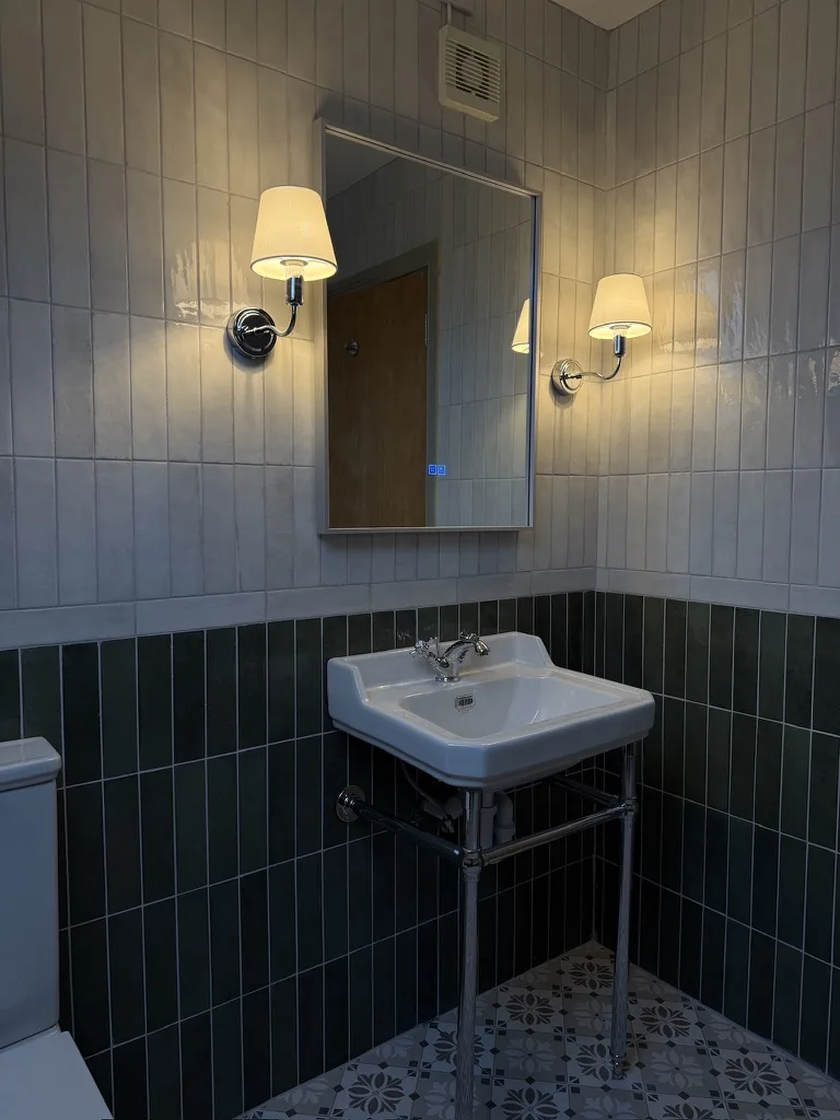 Renovated green ensuite bathroom at Donegal Manor