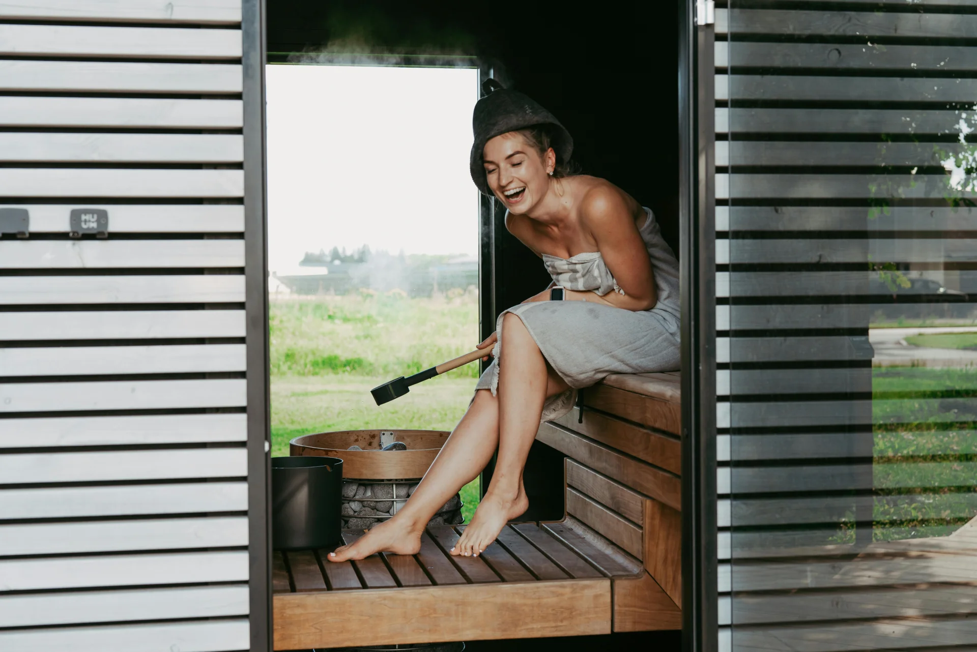 Person enjoying a wood-fired sauna